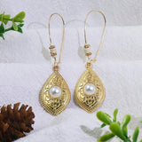 Boucles d'oreilles vintage en or avec perles ovales