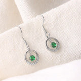 Boucles d'oreilles vintage en argent avec pierres précieuses vertes et cercles étincelants