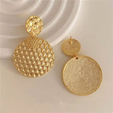 Boucles d'oreilles pendantes vintage en or avec texture nid d'abeille