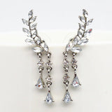 Boucles d'oreilles pendantes en cristal avec motif feuille d'argent