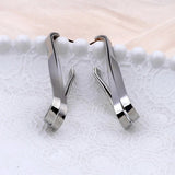 Boucles d'oreilles pendantes vintage en argent irrégulières torsadées