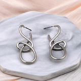Boucles d'oreilles vintage en argent tressées et nouées