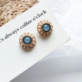Boucles d'oreilles vintage en or et perles avec pierres bleues