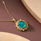 Collier vintage avec pendentif ovale en or et cristal filigrané