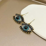 Boucles d'oreilles pendantes classiques avec cristaux noirs et bleus