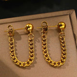 Boucles d'oreilles vintage en or avec chaîne à pompons