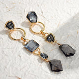 Boucles d'oreilles vintage en cristal noir et or