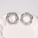 Boucles d'oreilles vintage en argent martelé en forme de fleur