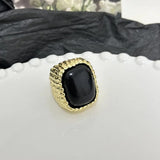 Bague ajustable vintage en or et pierre noire