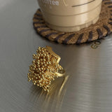 Bague ajustable en or avec boules audacieuses et cluster