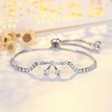 Bracelet vintage avec pendentif en cristal argenté en forme de nœud et pendentif