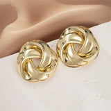 Boucles d'oreilles intemporelles en or avec nœud torsadé