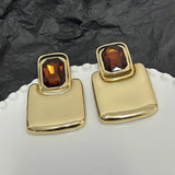 Boucles d'oreilles clous carrées en cristal brun doré avec pierres précieuses