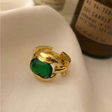 Bague vintage en or ajustable avec pierre précieuse verte