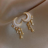 Boucles d'oreilles vintage en or avec lune et étoile en cristal