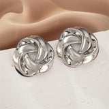 Boucles d'oreilles classiques en argent en forme de nœud