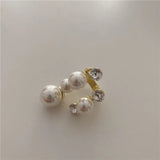 Bague vintage en or avec perle et strass