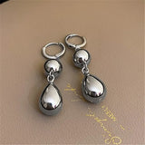 Boucles d'oreilles vintage en argent poli en forme de goutte