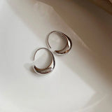 Boucles d'oreilles vintage en argent avec motif croissant incurvé
