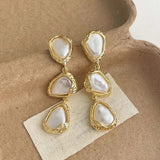 Boucles d'oreilles triangulaires nacrées plaquées or