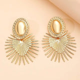 Boucles d'oreilles ovales en or et évasées avec motif soleil rayonnant