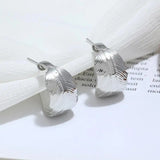 Boucles d'oreilles vintage en argent avec plumes