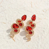 Boucles d'oreilles vintage en cristal rouge serpent et or
