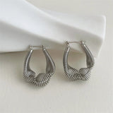Boucles d'oreilles créoles vintage en argent avec spirale artistique incurvée