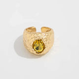 Bague ajustable en or avec pierre jaune accrocheuse