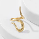 Bague ouverte en or au design abstrait torsadé