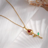 Collier vintage en or rose et pierres précieuses rouges