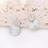 Boucles d'oreilles géométriques en argent texturé