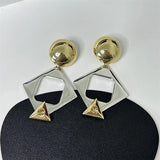 Boucles d'oreilles triangulaires classiques en or et argent avec cristaux