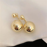 Boucles d'oreilles vintage en or avec motif boule lisse