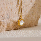 Collier vintage avec médaillon en or et perle