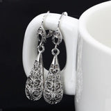 Boucles d'oreilles goutte en argent délicat avec motif filigrané intemporel
