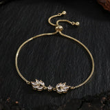 Bracelet ajustable en or avec motif floral et feuilles