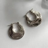 Boucles d'oreilles créoles épais en argent brillant en forme de croissant
