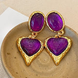 Boucles d'oreilles classiques en or avec pierres précieuses violettes en forme de cœur