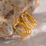 Boucles d'oreilles créoles vintage en or avec pompons