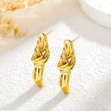 Boucles d'oreilles pendantes en ruban doré noué
