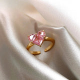 Bague ouverte vintage en or en forme de cœur avec pierre rose