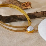 Bracelet vintage en or avec perles pendantes