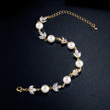 Bracelet vintage en or avec perles et feuilles
