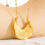 Collier vintage avec pendentif croissant en or