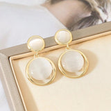 Boucles d'oreilles pendantes à cadre circulaire en or