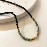 Collier en or et perles noires