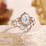 Bague vintage en or rose avec perle et pierre bleue