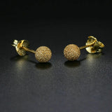 Boucles d'oreilles clous en or scintillant avec motif boule texturé