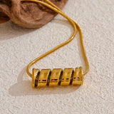 Collier vintage avec pendentif en spirale doré